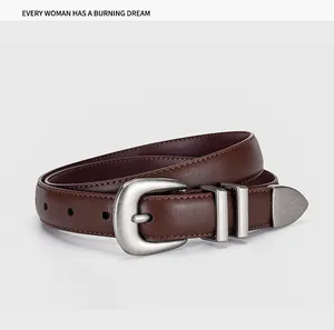 Detail view of vintage dark brown leather belt with matte silver buckle and fine texture