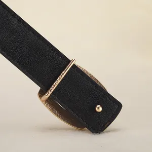 Classic black leather belt for women featuring a minimalist gold buckle and fine texture
