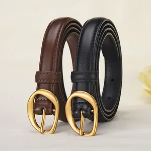 Women's vintage leather belt set in black and brown with gold horseshoe buckles