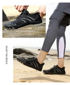 Macro detail of quick-dry water shoe with drainage holes on a sunny beach background