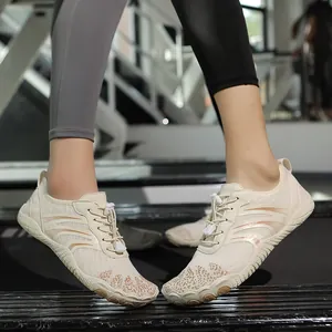 Cream-colored barefoot water shoes for outdoors with breathable mesh and elastic laces