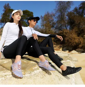 Detail of outdoor wading shoes showing breathable mesh upper and quick-lace system