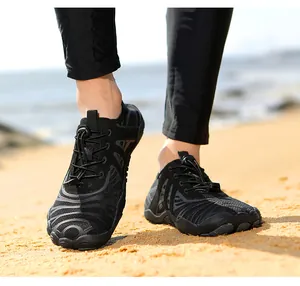 Close-up of black barefoot water shoes with quick-dry mesh and flexible rubber sole