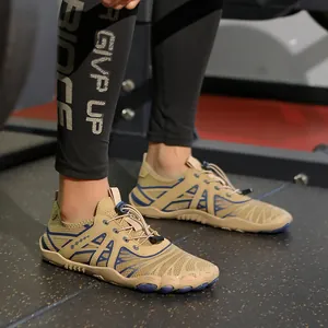 Quick-dry barefoot water shoes in tan and navy mesh with adjustable laces and rubber soles