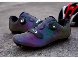 Detail of gradient cycling shoe with rotary dial closure and breathable perforations