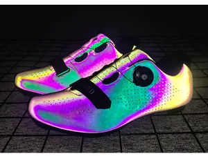 Detail of reflective cycling shoes with rotary buckle and breathable laser-cut holes