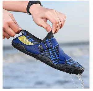 Close-up of quick-dry water shoes with yellow honeycomb pattern and adjustable strap in water