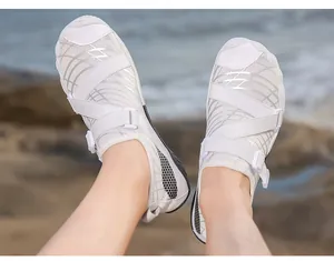 Detail of white quick-dry water shoe with breathable mesh and adjustable straps