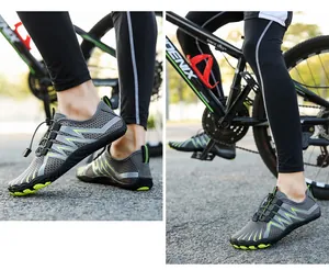 Macro detail of breathable grey mesh outdoor shoe with vibrant green geometric lines