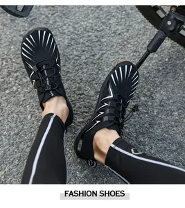 Outdoor water shoes with elastic drawstring on a gravel path next to a bike