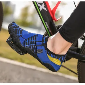 Detail of blue quick-dry water shoes on bicycle pedals showing anti-slip rubber soles