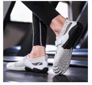 Detail of breathable mesh and non-slip rubber sole on a grey quick-dry wading shoe