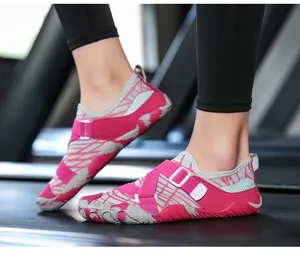 Detailed side view of rose red quick-dry water shoes with anti-slip rubber soles for gym