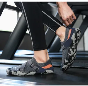Detail of breathable quick-dry water shoe with orange honeycomb pattern and cross-strap system