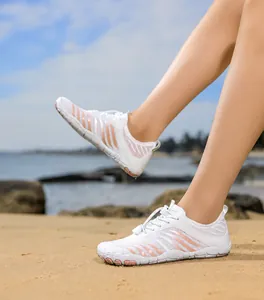 Women's beach shoes with breathable white mesh, pink wave pattern, and anti-slip sole