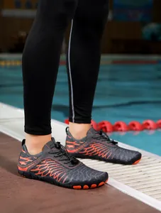 Detail of multi-purpose wading shoes with orange coral patterns and elastic lace system