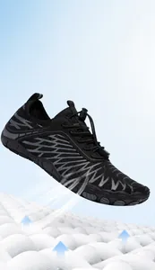 Detail showing breathable mesh upper and elastic drawstring on black hiking water shoes