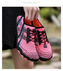 Detail of rose red trekking shoe with quick-lace system and breathable mesh upper