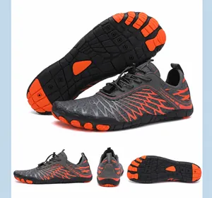 Detail view of grey and orange five-finger water shoes with anti-slip rubber sole