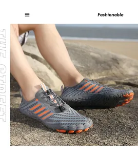 Quick-dry barefoot water shoes with grey mesh upper and orange rubber grip outsole