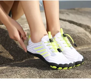 Detail of breathable mesh hiking shoes with quick-dry drain holes and toggle laces