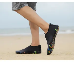 Outdoor water shoes with quick-dry mesh and colorful camouflage sole on sandy beach