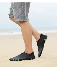 Outdoor wading shoe side view on beach showing breathable mesh and colorful sole