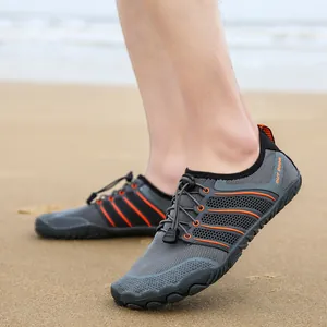 Outdoor water shoes with gray mesh, orange stripes, and quick-lace system for beach use