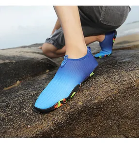 Macro detail of breathable blue gradient water shoes showing durable anti-slip rubber sole