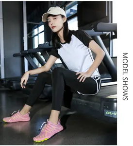 Detailed close-up of pink barefoot water shoe with mesh upper and quick-lace system