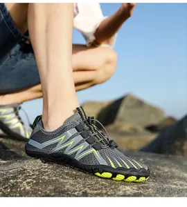 Outdoor water shoes with dark grey mesh and vibrant green wave pattern and anti-slip sole
