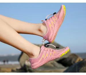 Outdoor action shot showing pink hiking water shoes with quick-dry mesh and non-slip sole