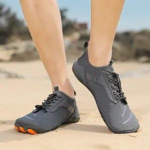 Detail of gray quick-dry wading shoes with orange toe protection for beach and hiking