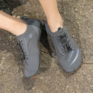 Macro shot of breathable mesh surface and quick-lace system on outdoor barefoot shoes