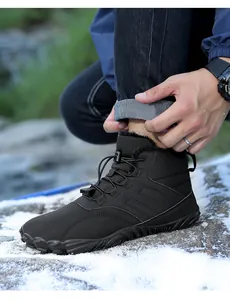 Detail of high-top winter snow boots with warm plush lining and anti-slip rubber outsole