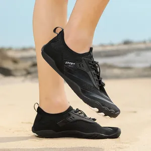 Close-up of quick-lace system and breathable honeycomb mesh on black outdoor wading shoes