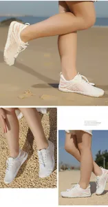 Dettaglio di scarpe da scoglio per bambini in mesh bianco con motivi rosa e chiusura