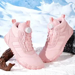 Pink waterproof snow boots with plush lining and swivel buckle on snowy mountain background