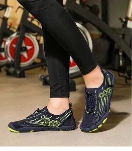 Close-up of mesh wading shoes with quick-lace system in a gym fitness setting