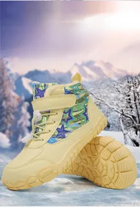 Detail showing the thick faux fur lining and anti-slip rubber sole of children's snow boots