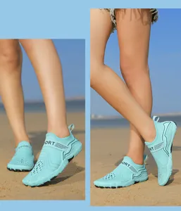 Macro detail of breathable aqua shoes with drainage holes and anti-slip rubber sole