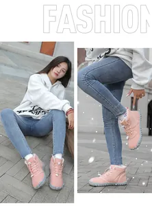 Pink high-top winter snow boots featuring warm white fleece lining and non-slip grey soles