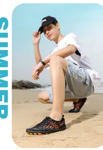 Outdoor water shoe detail with orange flame pattern and quick-pull lacing on beach