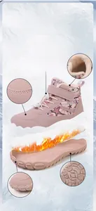 Detail of pink winter boots showing the warm plush lining and waterproof star fabric