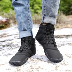 Waterproof winter hiking boots with warm faux fur lining and anti-slip rubber soles on snow