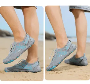 Detail of grey quick-dry water shoes featuring mesh fabric and a durable rubber outsole