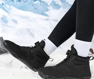 Waterproof outdoor snow boots with rotary buckle closure and warm fleece lining in snow