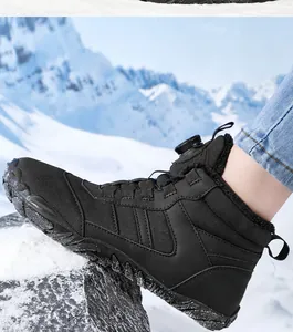 Detail of outdoor snow boots with rotary buckle closure and warm fleece lining for hiking