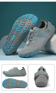 Detail of grey water shoes with drainage rubber sole and quick-dry mesh for outdoor hiking