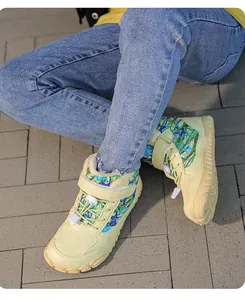 Close-up of children's warm barefoot boots featuring fleece lining and star patterns